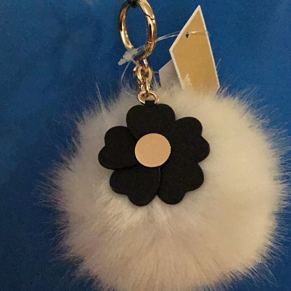 MK’s faux fur optic white keychain puff